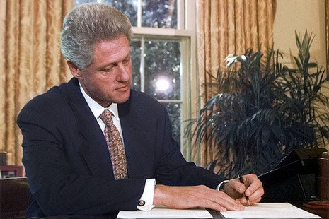 President Bill Clinton signing the Religious Freedom Act in the Oval Office